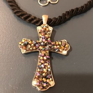 Cross charm on rope